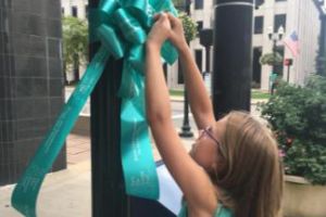 Lexington KY Girl Placing Ribbon